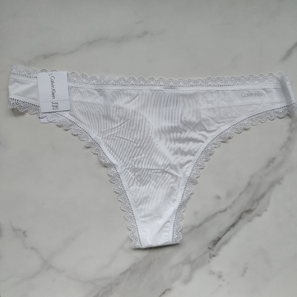 NWT CALVIN KLEIN FLIRTY MICRO THONG PANTY IN WHITE SIZE EXTRA LARGE